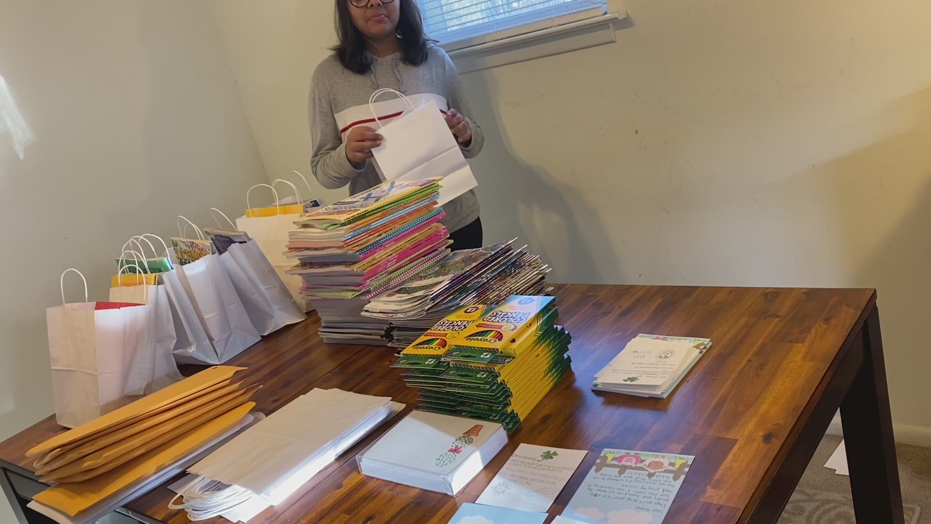 Fifteen-year-old Hita Gupta demonstrates how she makes care packs for seniors quarantined during the coronavirus pandemic.