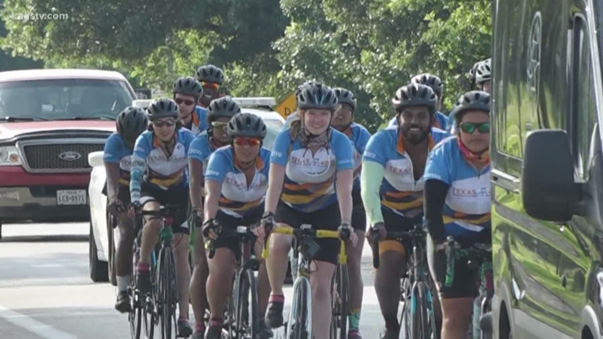 Over 20 University of Texas students rode through College Station in part of a 70-day cross country bike ride to fight cancer.