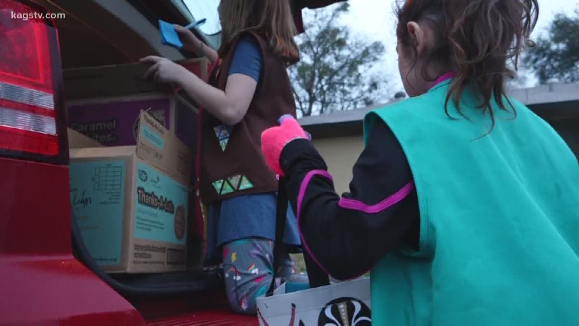 KAGS went door-to-door with Girl Scouts as the first day of cookie selling began.