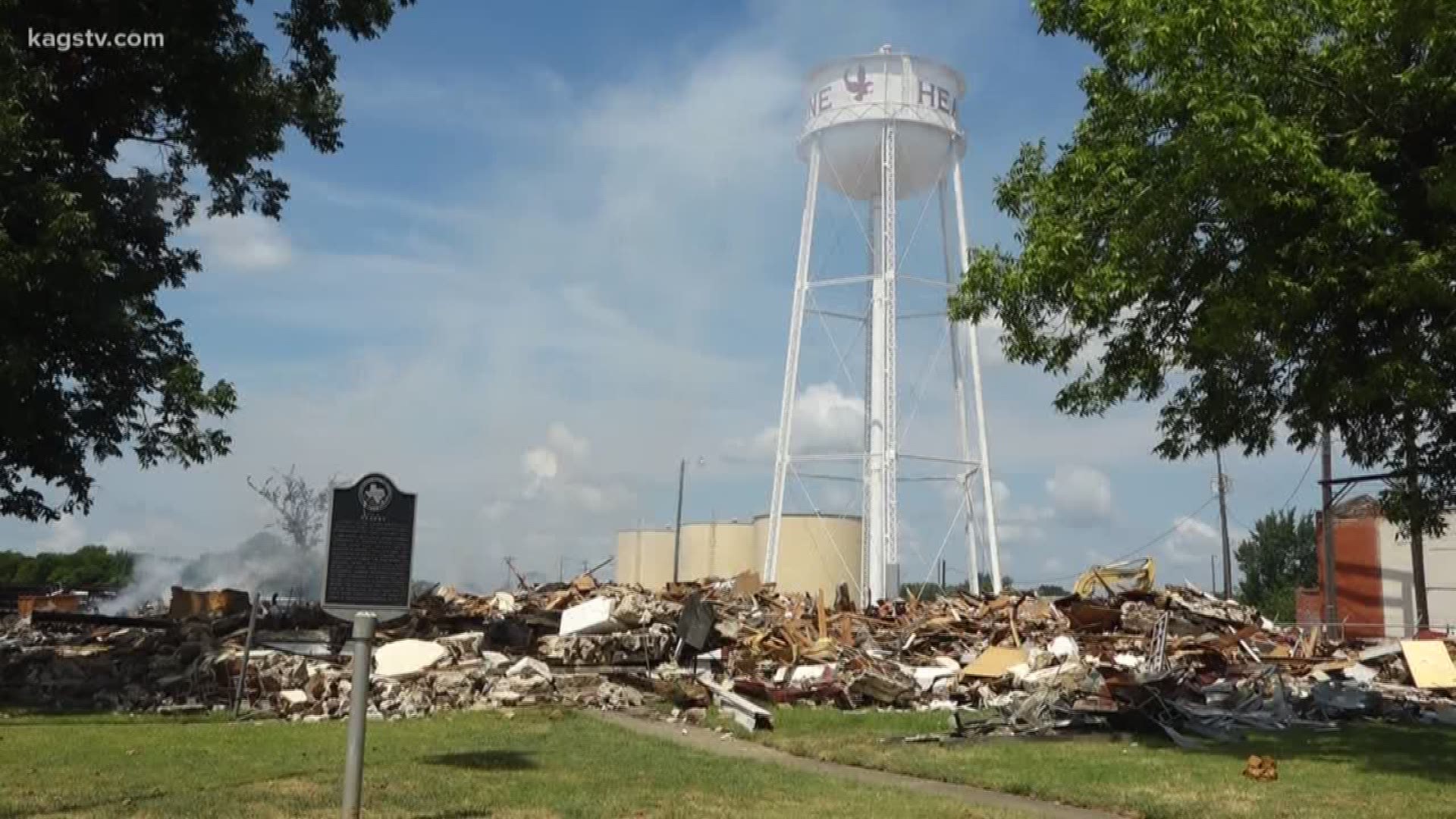 The rubble caught fire, and then was re-ignited later in the morning. Authorities are investigating the cause.