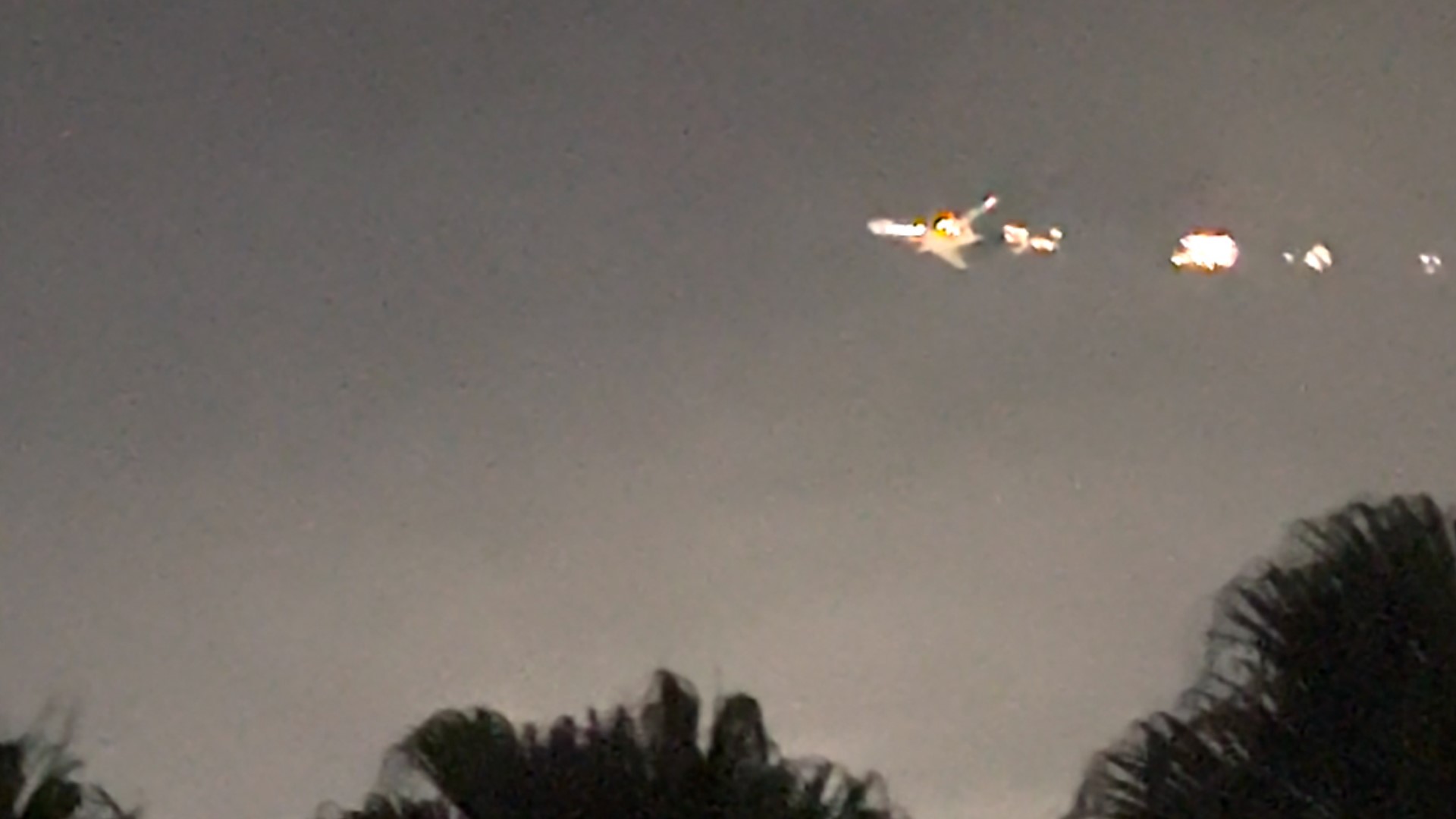 A witness saw sparks shooting from a cargo plane as it made an emergency landing at Miami International Airport shortly after takeoff.